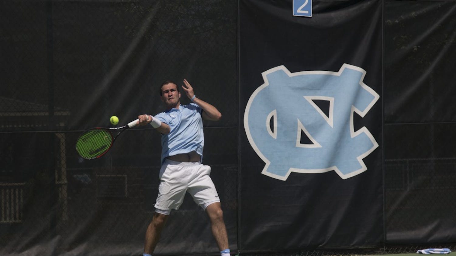 UNC Men's Tennis players William Blumberg (freshman, left) and Robert Kelly (junior, right) celebrate a point during their doubles match on Sunday afternoon against Florida State players Jose Garcia (junior) and Lucas Poullain (junior).