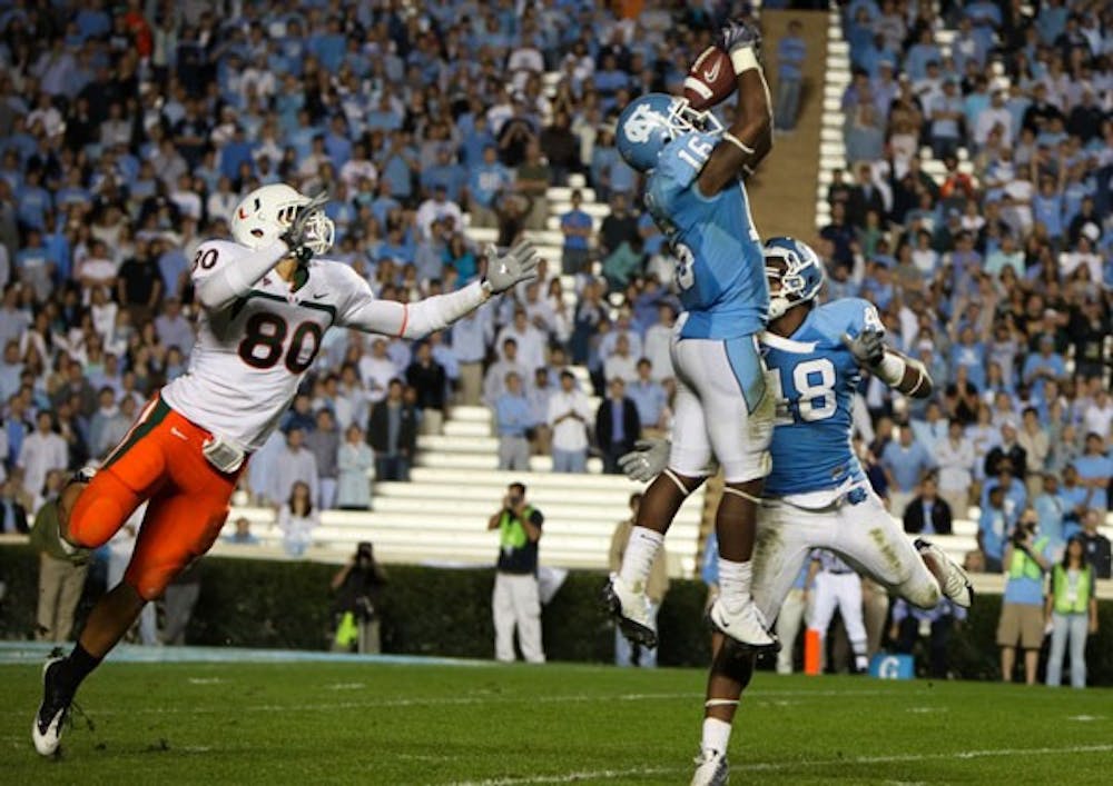 Kendric Burney (16) intercepted Miami quarterback Jacory Harris three times Saturday, with two leading to scores. DTH/Phong Dinh