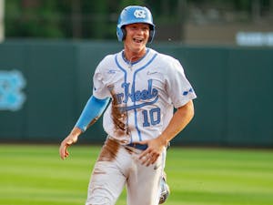 UNC first year infielder Mac Horvath (10) smiles as he runs to home base to score at the game against UNCW on Tuesday May 18, 2021 at Boshamer stadium. The Tar Heels won 14-9.