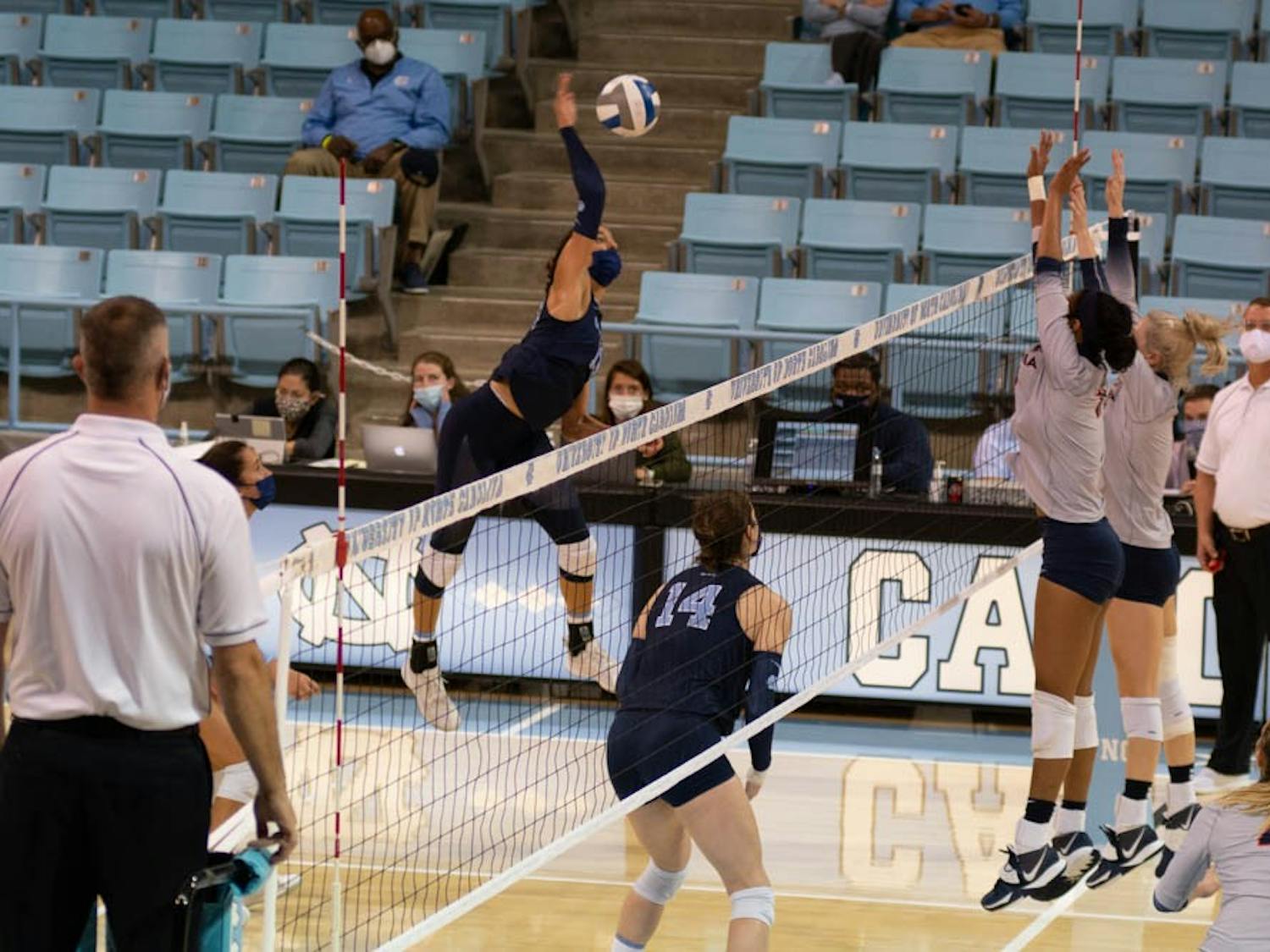 UNC sophomore outside hitter Carly Peck (13) strikes the ball during a set against Virginia during a game against the University of Virginia in Carmichael Arena on Sunday, Nov. 1, 2020. UNC finished their season that night with A 3-1 win.