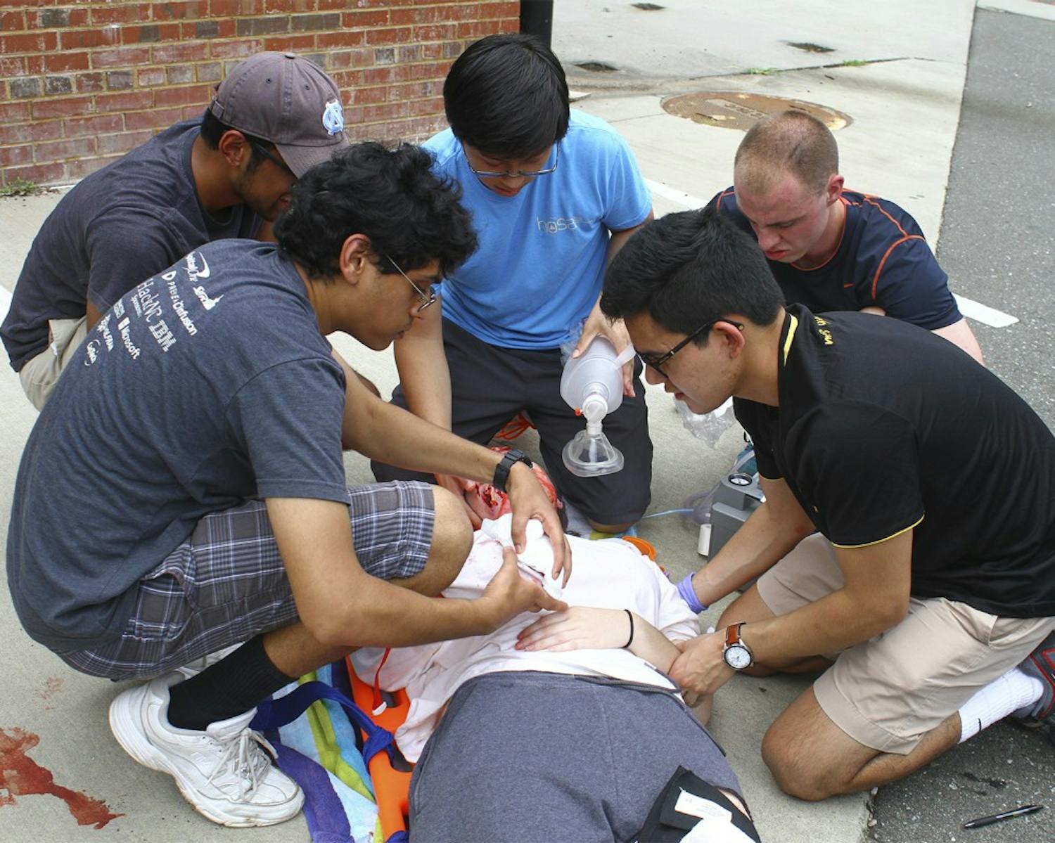 Students learn how to save a car crash victim as a part of ACERIP’s Trauma Day in the organization’s EMS certification class on Saturday.