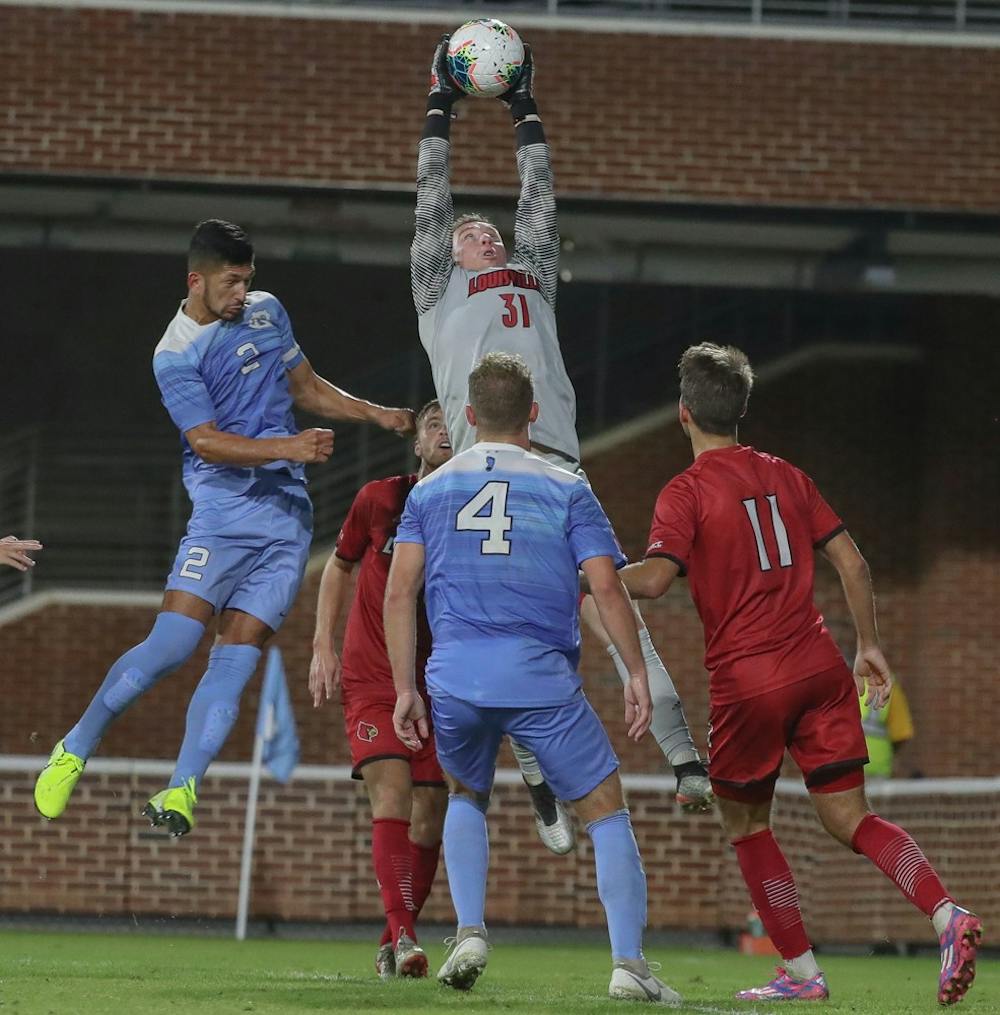 Senior Mauricio Pineda (2) goes in for a header during the game on Friday, Oct. 25, 2019 in Anson Dorrance field. UNC lost to Louisville 0-1. 