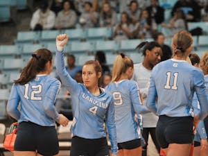 UNC player Olivia Diaz (4) raises a supportive fist at the game against Georgia Tech on Friday, Nov. 1, 2019 in the Carmichael Arena. UNC lost 2-3.