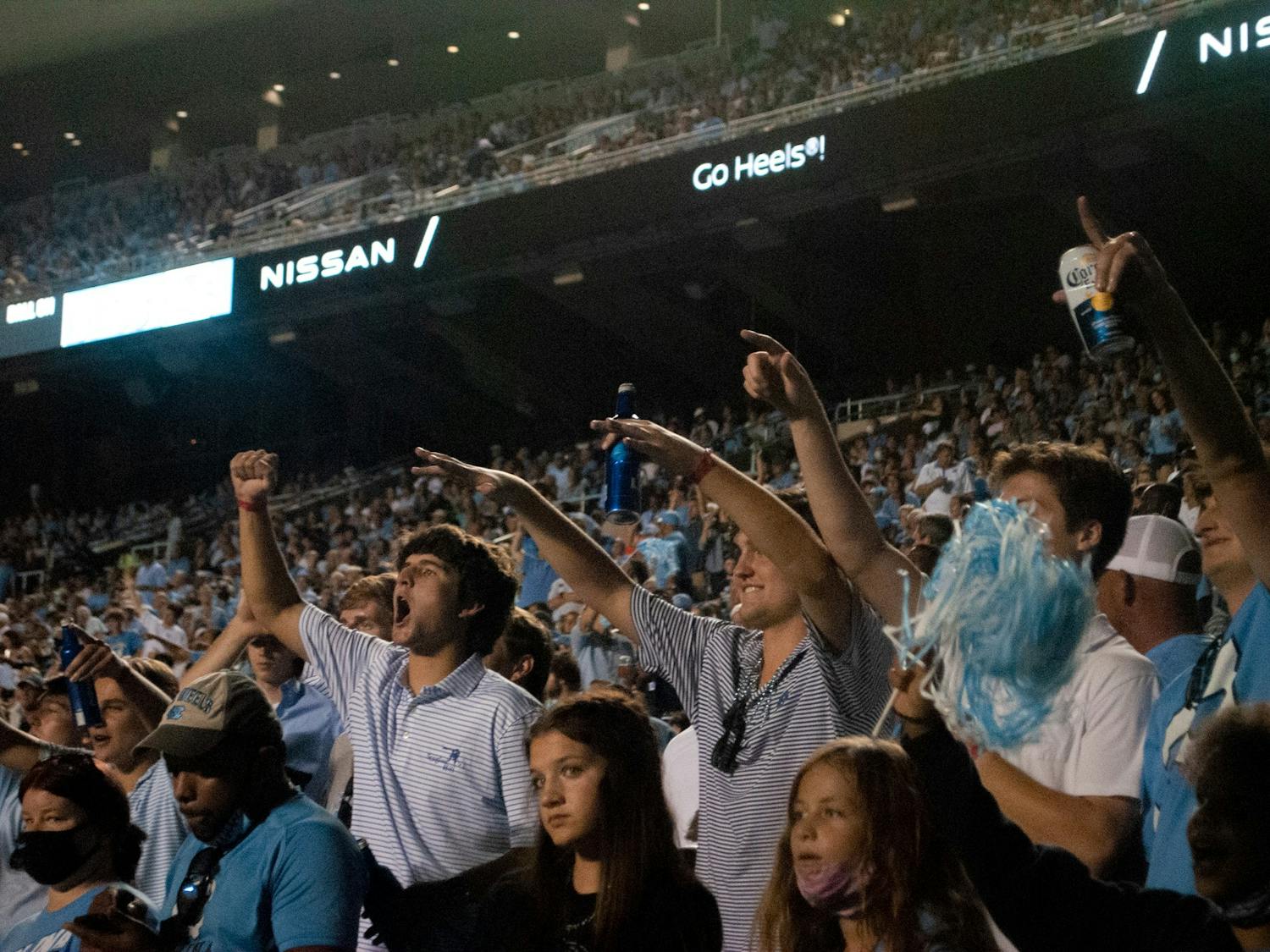Fans cheer for Tar Heel football in Kenan Stadium at Saturday's home game against the University of Virginia on Saturday. UNC defeated the Cavaliers 59-39, making for their second win of the season.