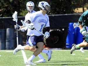 Sophomore Luke Goldstock prepares to shoot against Manhattan as a part of his historic nine-point performance, the most of any Tar Heel since 2012.