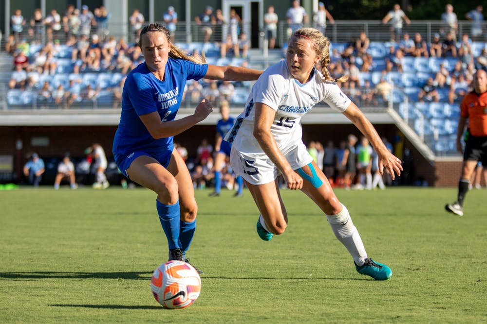 Junior defender/midfielder Avery Patterson (15) fights for the ball during UNC's second exhibition game against BYU at Dorrance Field on Saturday, Aug. 13, 2022.
