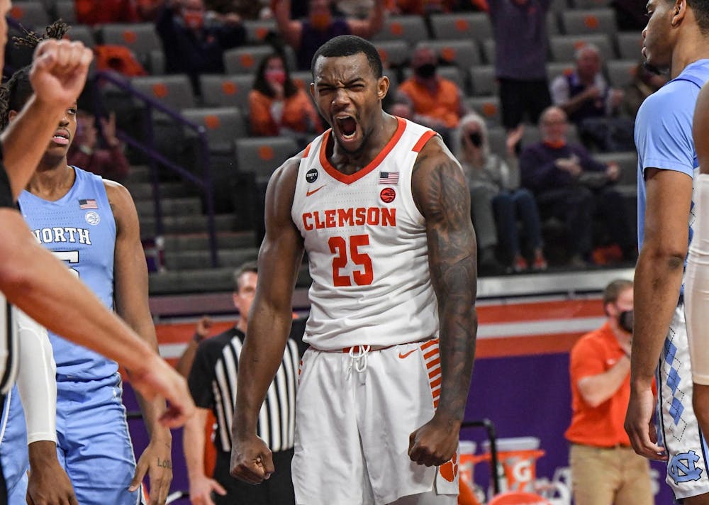 Clemson senior forward Aamir Simms(25) reacts after scoring against North Carolina during the second half of a game at Littlejohn Coliseum on Feb 2, 2021; Clemson, South Carolina, USA. Photo courtesy of Ken Ruinard. 