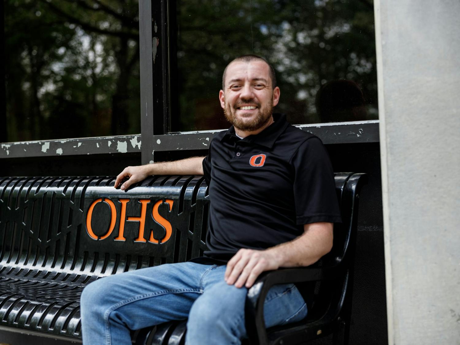 David Gaddy, the winner of Orange High School's teacher of the year and math department chair, sits outside of Orange High School on April 16, 2023. 