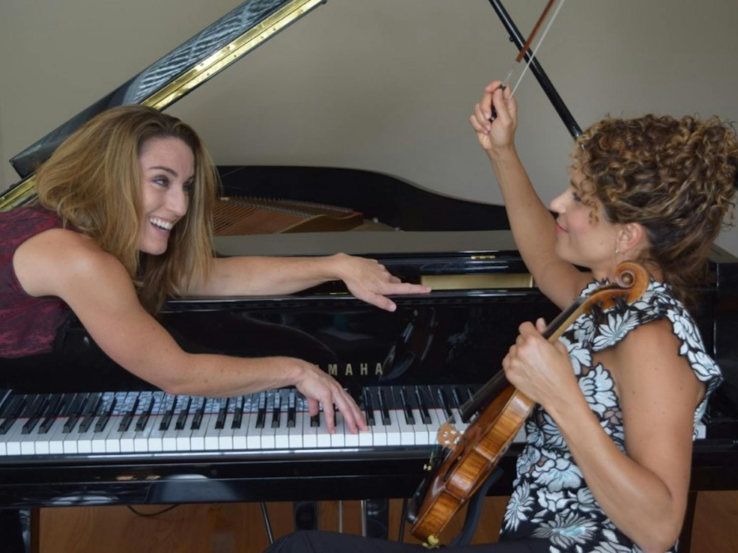 Violinist Jacqueline Saed Wolborsky and pianist Danielle DeSwert Hahn rehearsing for their performance Corsets unLACEd, on Oct. 27. Photo courtesy of Steve Hahn. 