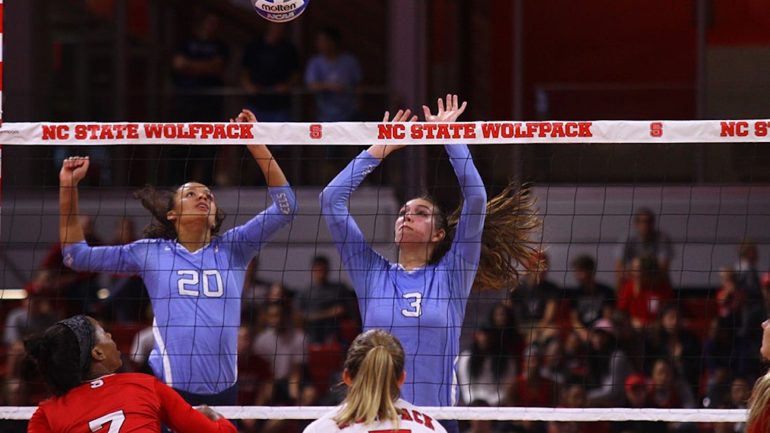 Taylor Treacy (20) and Beth Nordhorn (3) go up for the block against N.C. State.