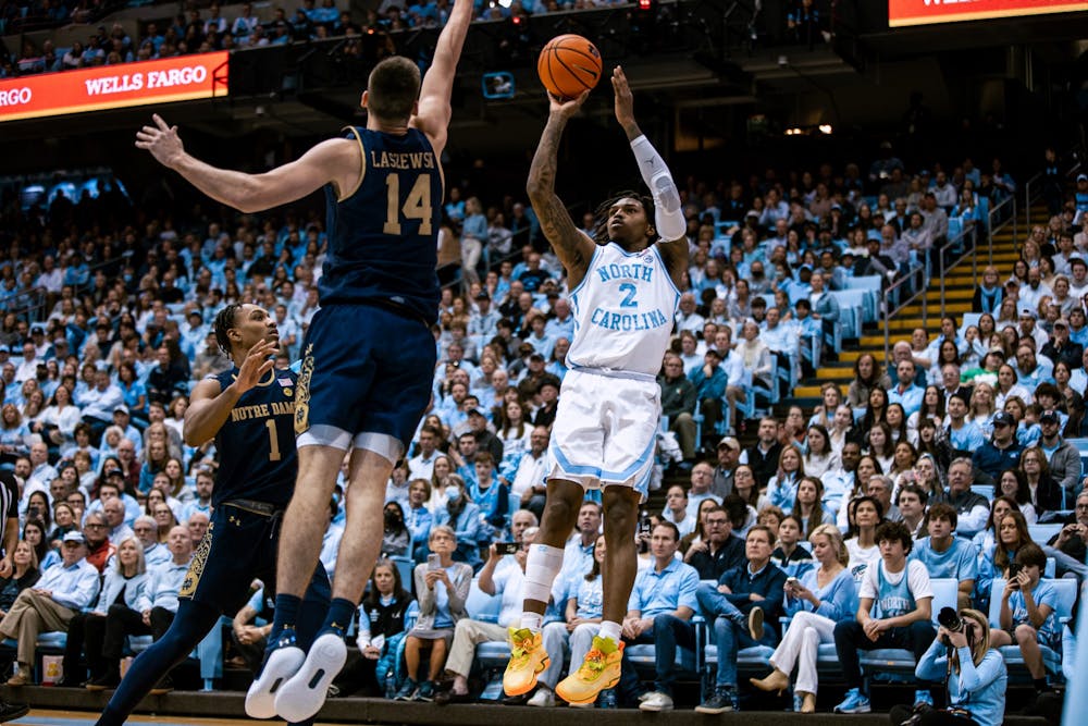 UNC junior Caleb Love (2) shoots a three during the second half of the basketball game against Notre Dame on Saturday, Jan. 7, 2023. UNC won 81-64 at the Smith Center.
