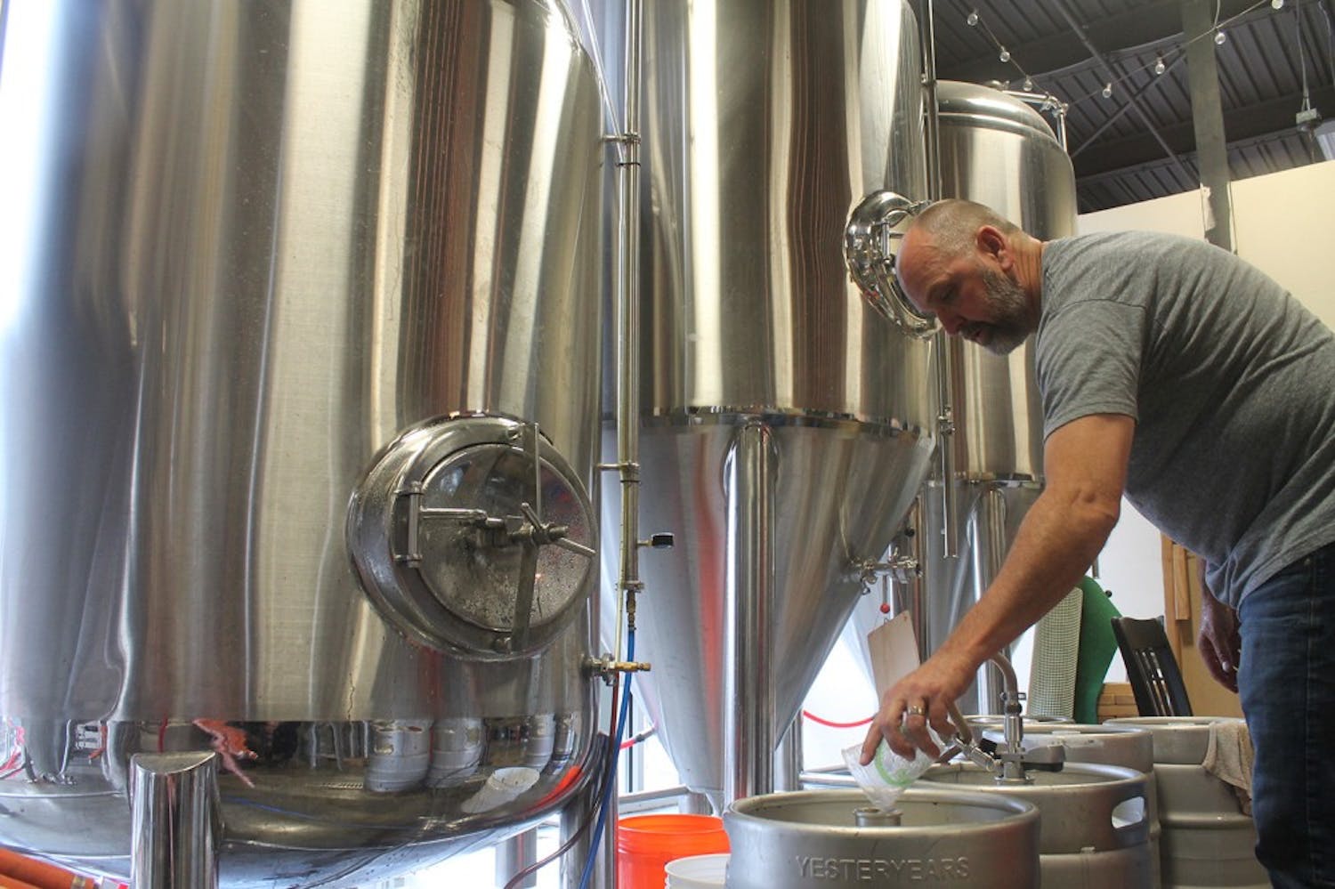 David Larsen. the owner of YesterYears Brewery, from Pensacola prepares kegs with freshly brewed beer.