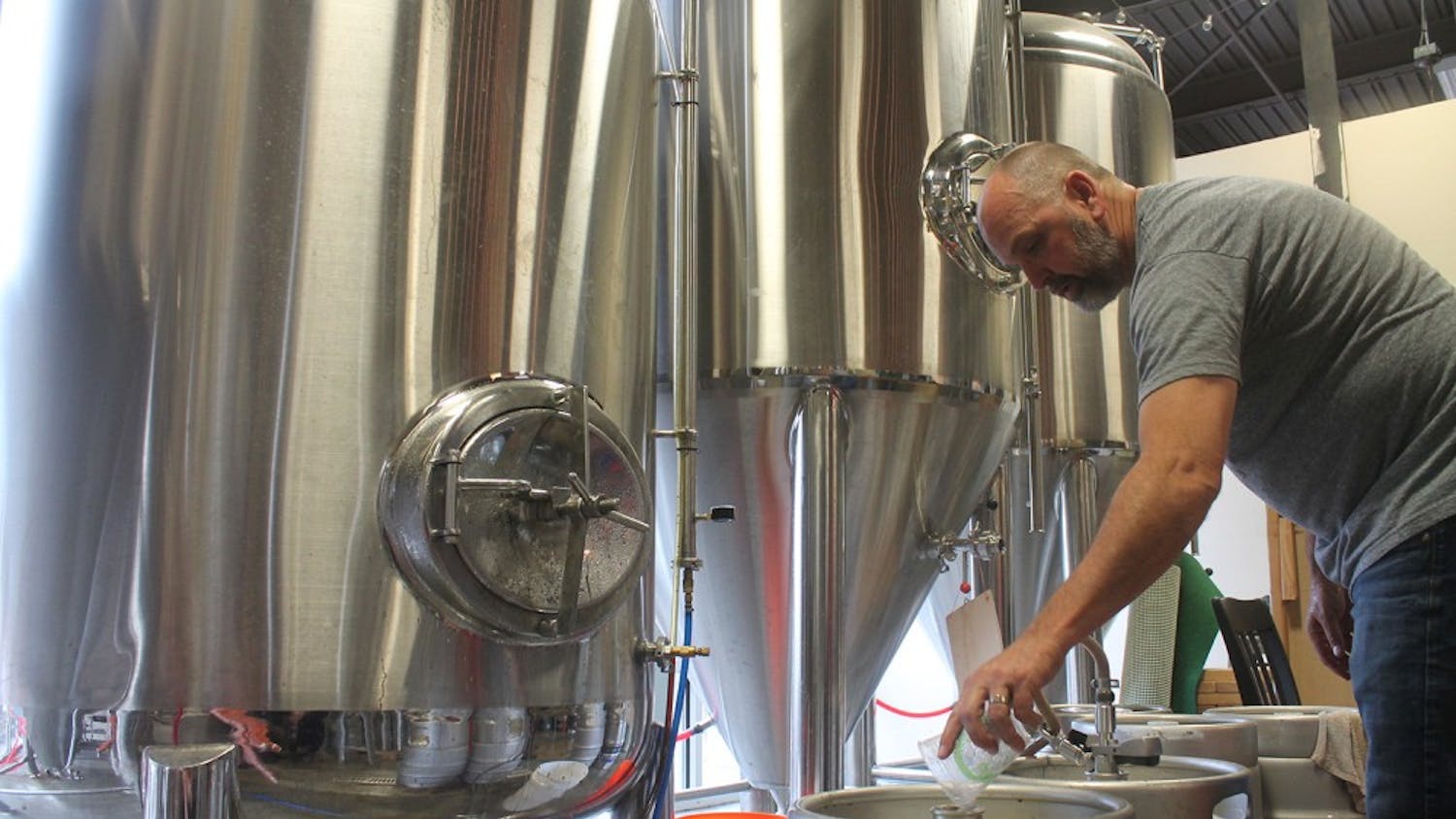 David Larsen. the owner of YesterYears Brewery, from Pensacola prepares kegs with freshly brewed beer.