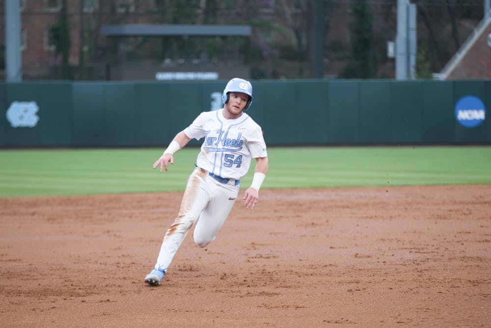 UNC junior catcher Max Riemer (54) runs the bases during a home game at Boshamer Stadium against Appalachian State on Tuesday, March 22, 2022.