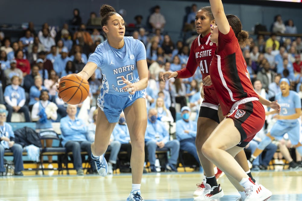 <p>UNC sophomore forward Destiny Adams (20) passes the ball during the women's basketball game against N.C. State at Carmichael Arena on Sunday, Jan. 15, 2023. UNC beat N.C. State 56-47.</p>