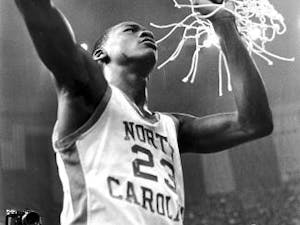 Michael Jordan helps cut down the nets after the 1982 NCAA National Championship. Photo courtesy of UNC Athletic Communications.