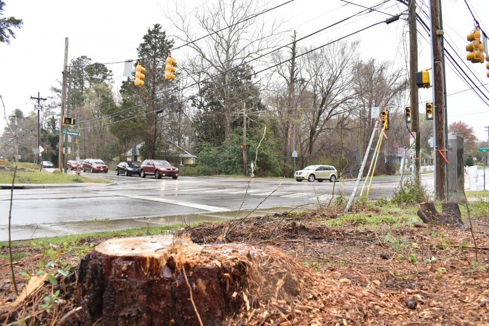 At the intersection of Estes Dr. and North Greensboro St. trees have been cut down and power lines are being relocated as the city of Carrboro is starting to prepare for construction on a roundabout on that intersection. Photographed on April 2, 2019.