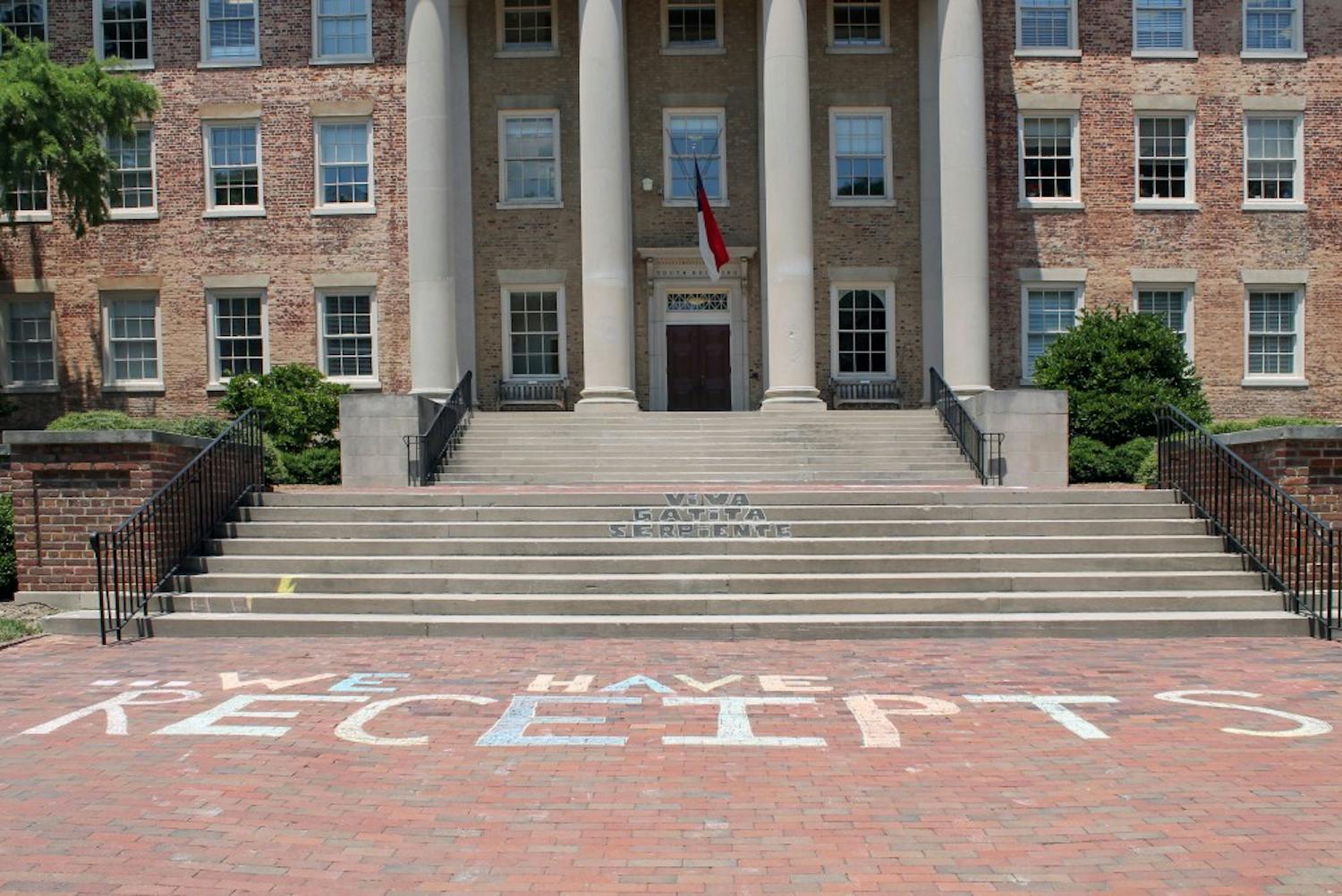 On July 11, protestors chalked "We Have Receipts" on the bricks in front of South Building. 