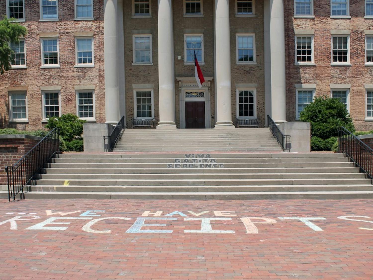 On July 11, protestors chalked "We Have Receipts" on the bricks in front of South Building. 