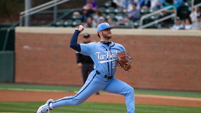 UNC junior right-handed pitcher Connor Bovair (27) throws the ball during the baseball game against ECU on Feb. 26, 2023, at Bryson Field at Boshamer Stadium. UNC lost 5-6.