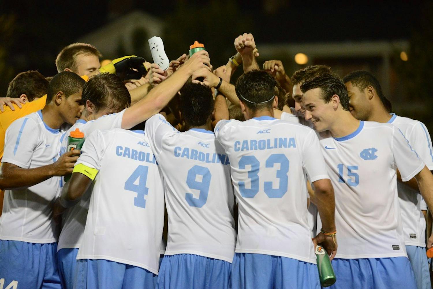 UNC huddles after defeating Monmouth 1-0 in the second overtime period.