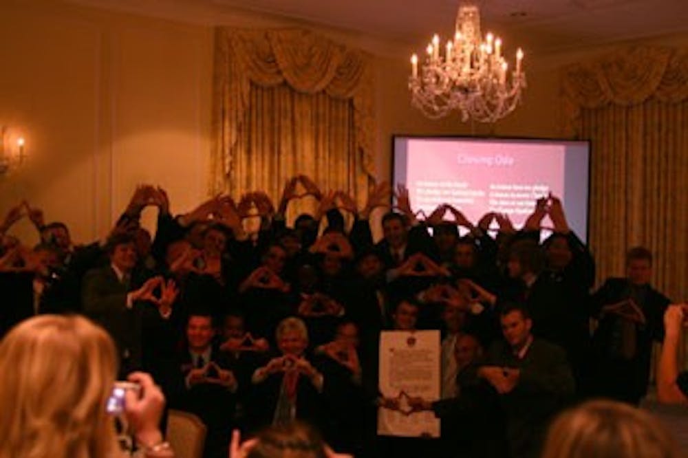 Brothers of Tau Kappa Epsilon, the largest fraternity in the world, pose for pictures at their indication dinner Saturday night 
