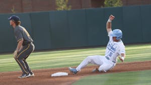 Catcher Eric Grintz (5) slides into second base during a baseball game against North Carolina A&T. UNC lost 6-7 at home on Tuesday, April 12, 2022.