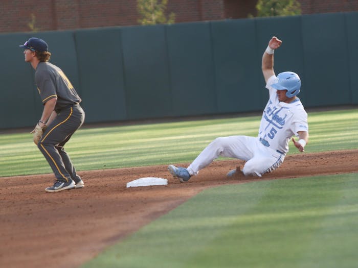 Catcher Eric Grintz (5) slides into second base during a baseball game against North Carolina A&T. UNC lost 6-7 at home on Tuesday, April 12, 2022.