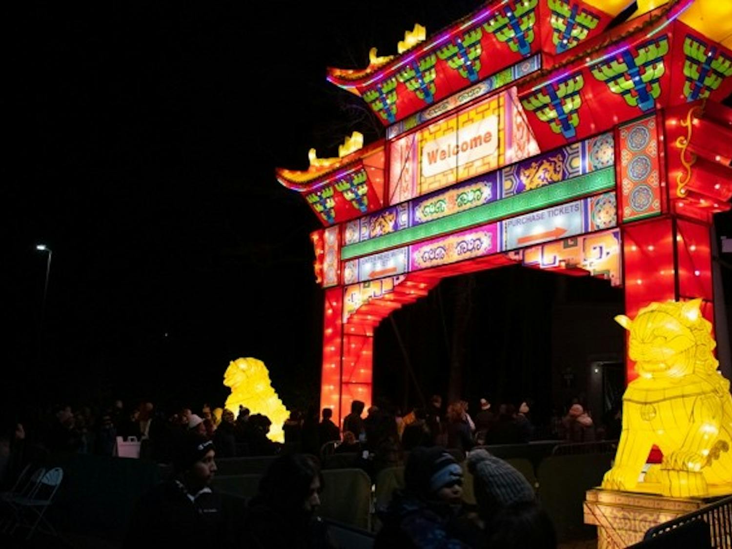 Attendees enter the NC Chinese Lantern Festival at the Koka Booth Amphitheatre in Raleigh, NC, after buying their tickets on Saturday, Jan. 8, 2022. 