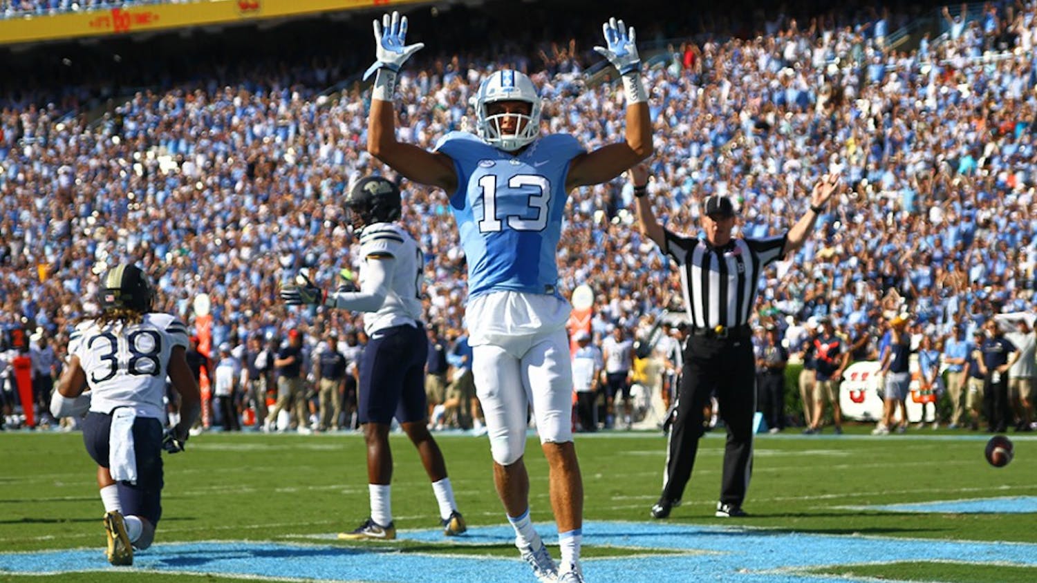 UNC wide receiver Mack Hollins (13) celebrates after scoring a touchdown against Pitt. The Tar Heels defeated the Panthers 37-36 on Saturday.