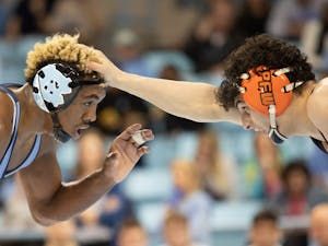 UNC redshirt junior Kennedy Monday and Princeton sophomore Grant Cuomo wrestle in weight class 165 on Friday, Jan. 11, 2020 in Carmichael Arena. No. 17 UNC defeated No. 12 Princeton 25-11.