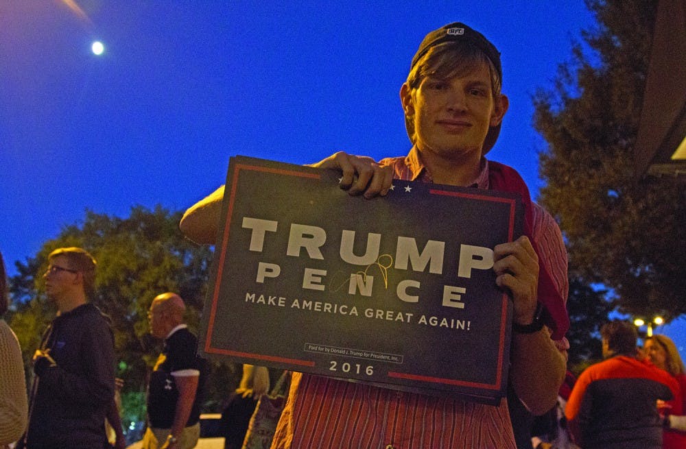 Aaron Aiken is one of many Trump supporters who showed up to the Pence rally Wednesday in Raleigh. 