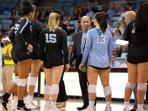 Head coach, Joe Sagula, talks to the players during a time out. UNC won agaisnt  FSU 3-2 at Carmichael Arena on Sunday Oct. 13, 2019.