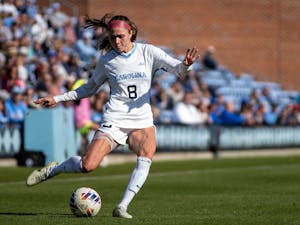 UNC senior forward Emily Moxley (8) passes the ball during the women's soccer game against BYU on Saturday, Nov. 19, 2022, at Dorrance Field. UNC beat BYU 3-2.