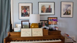 A piano and photos on display at The Jackson Center on Monday, Feb. 20, 2023.