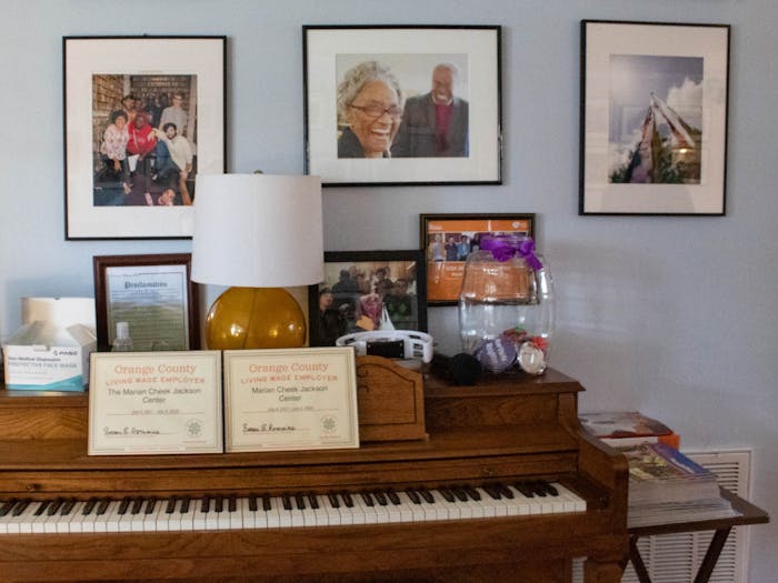 A piano and photos on display at The Jackson Center on Monday, Feb. 20, 2023.