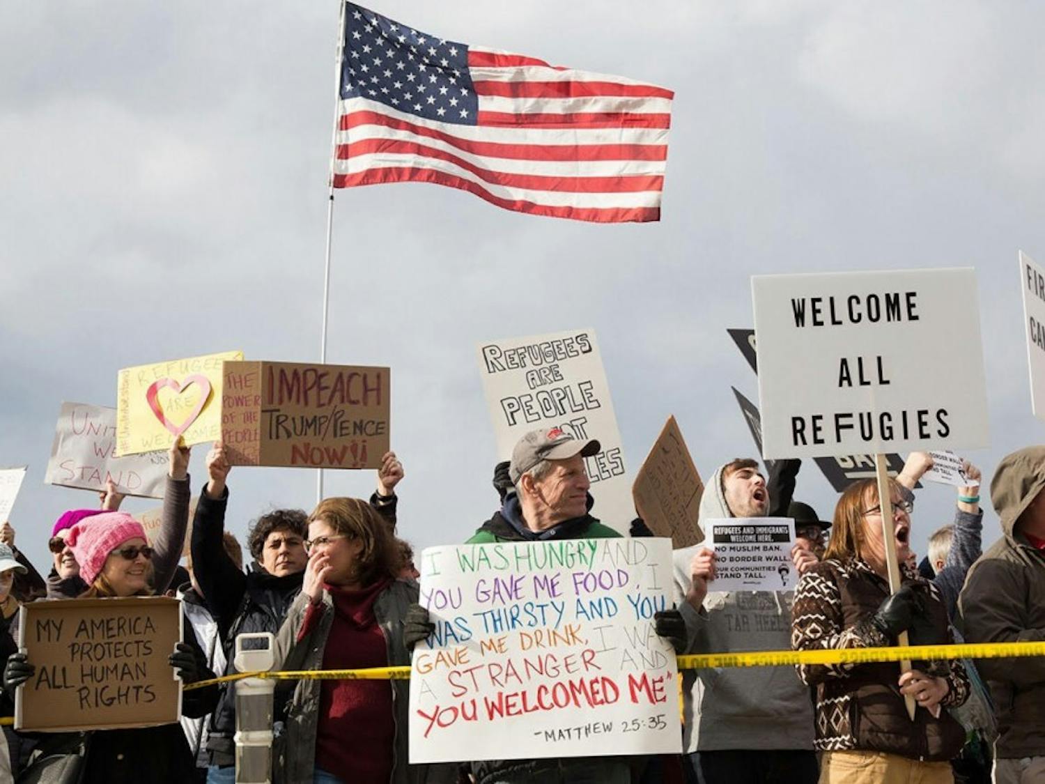 Protesters gather outside terminal two at RDU Airport on Jan. 29 in response to President Donald Trump's executive order banning immigrants from certain countries from entering the U.S.