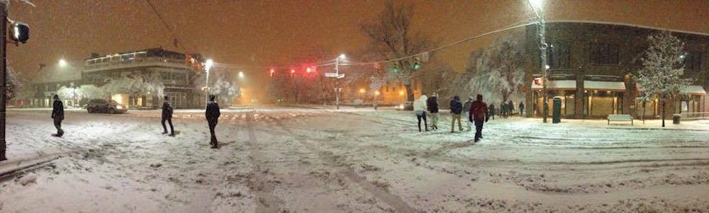 People walking on a snowy Franklin Street in Feb. 2015.
