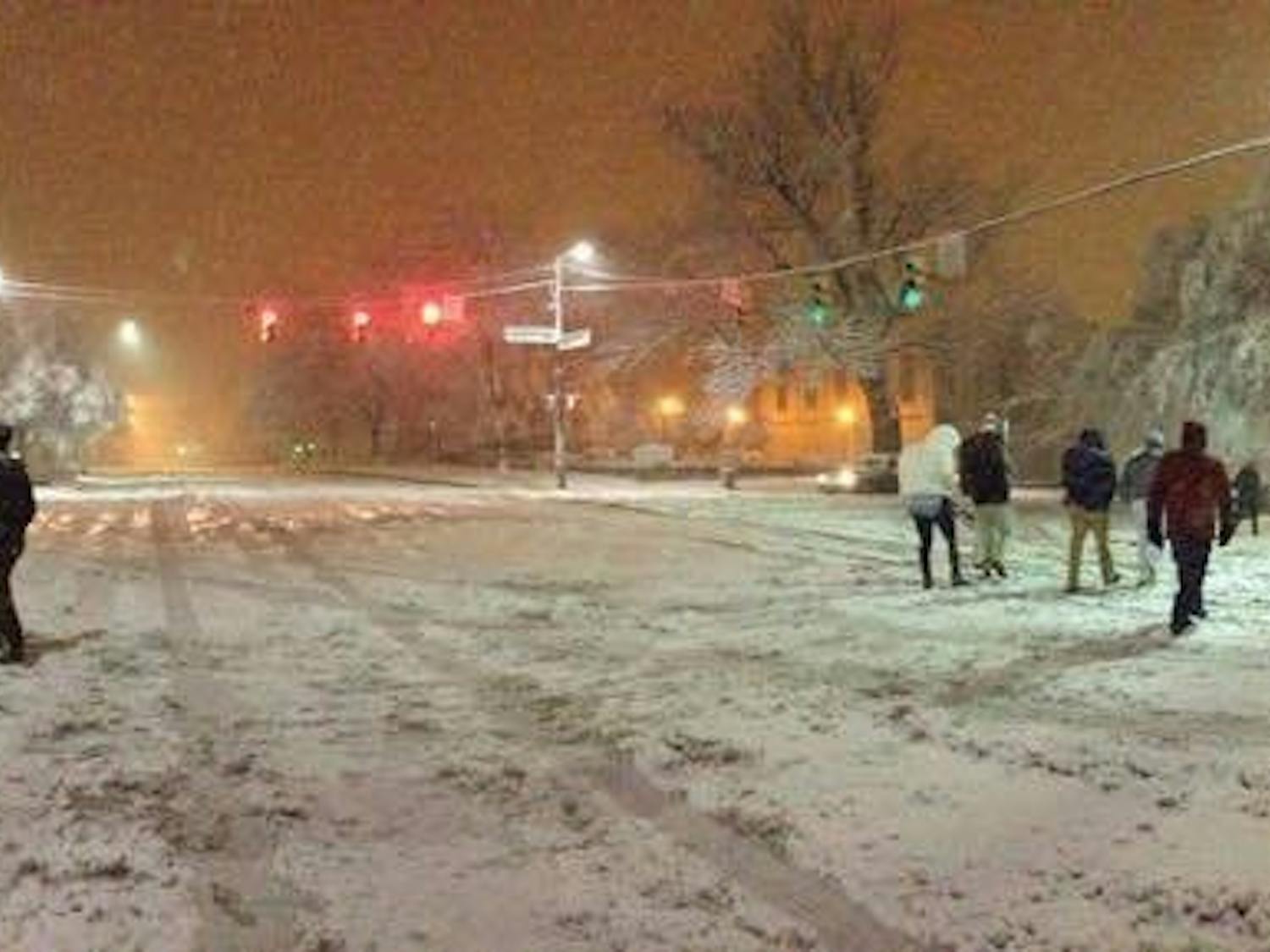People walking on a snowy Franklin Street in Feb. 2015.