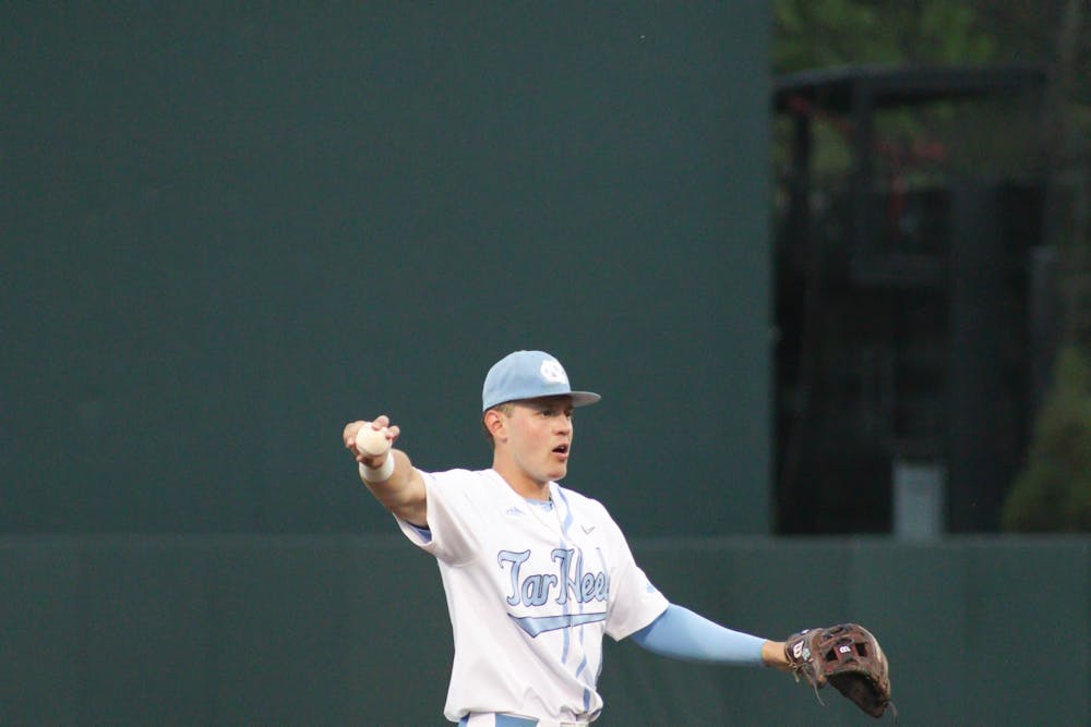 <p>Shortstop Danny Serretti (1) calls out after catching an outfield ball during a baseball game against North Carolina A&amp;T. UNC lost 6-7 at home on Tuesday, April 12, 2022.</p>