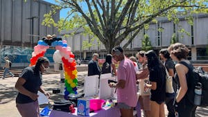 UNC students and staff celebrate Pride in the Pit with the LGBTQ Center on Tuesday, April 11, 2023. The event — part of University Pride Week — included various activities, giveaways and resource information.&nbsp;