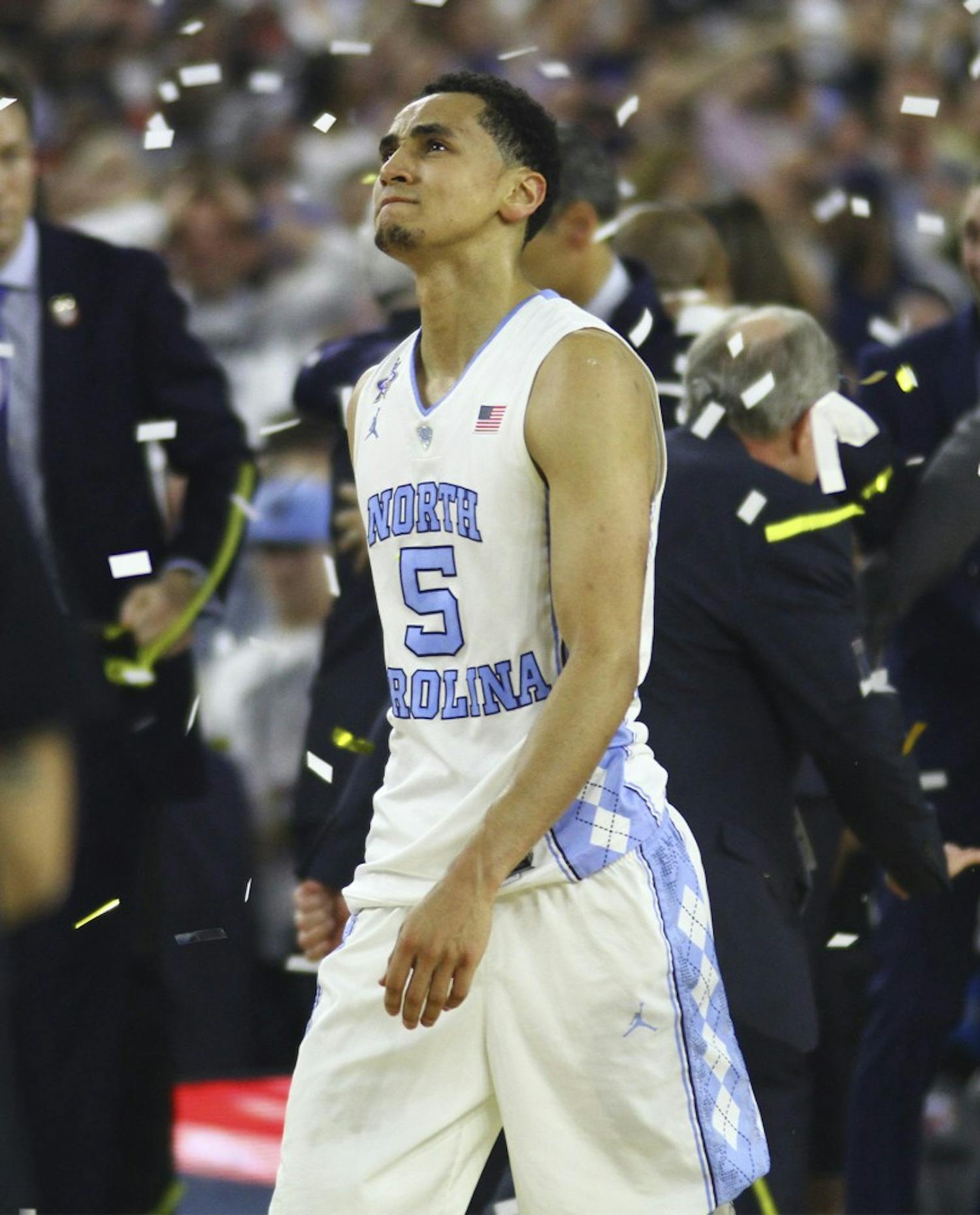 Senior Marcus Paige (5) walks off the court after a buzzer beater 77-74 loss to Villanova. Paige had made a three-pointer to briefly tie the game.