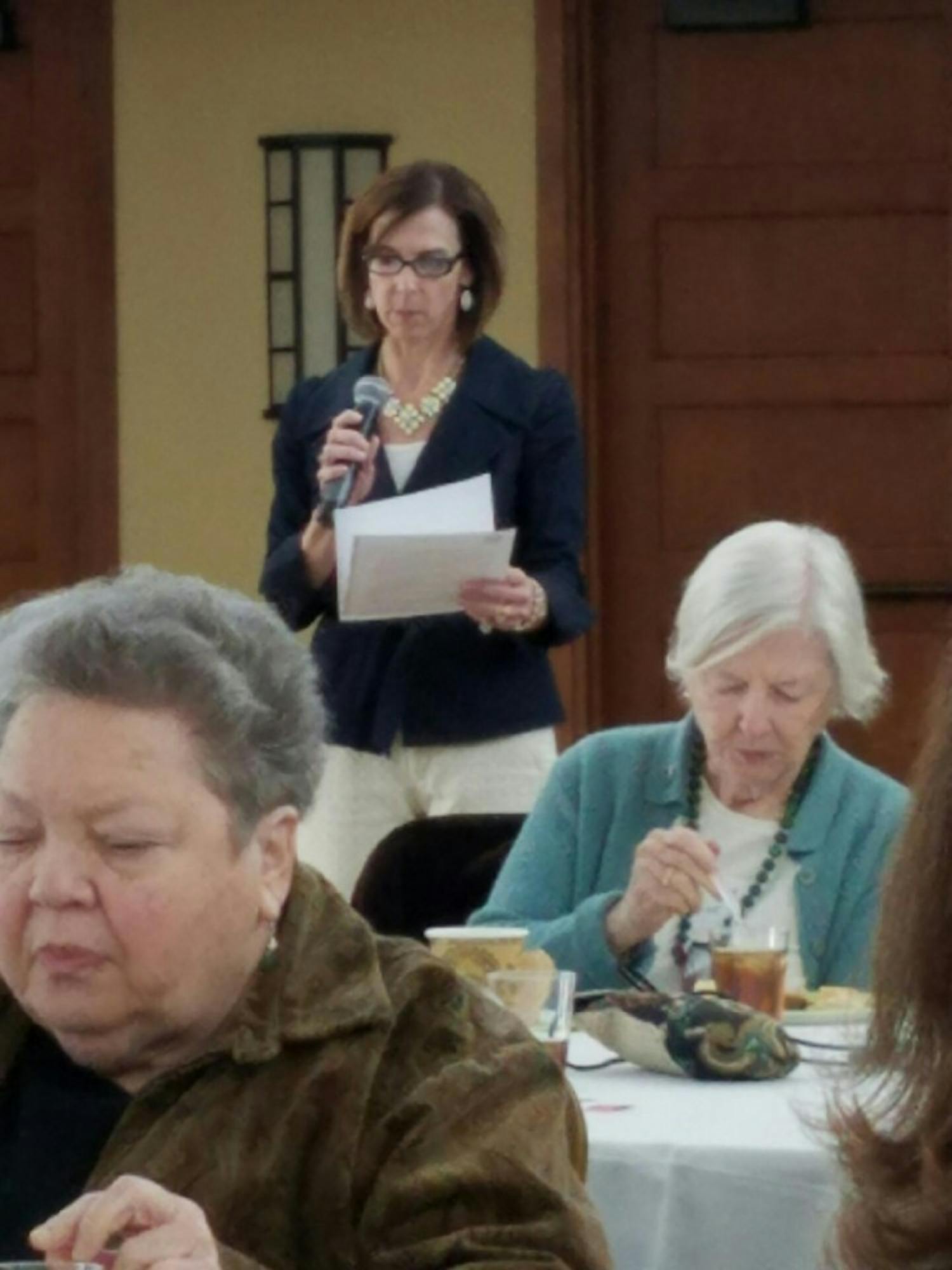 Stacey Yusko, the executive director of the Chapel Hill-Carrboro Meals on Wheels, speaks at a celebration event.