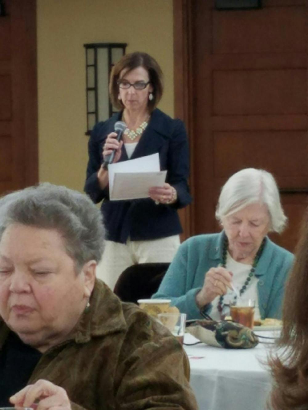 <p>Stacey Yusko, the executive director of the Chapel Hill-Carrboro Meals on Wheels, speaks at a celebration event.</p>
