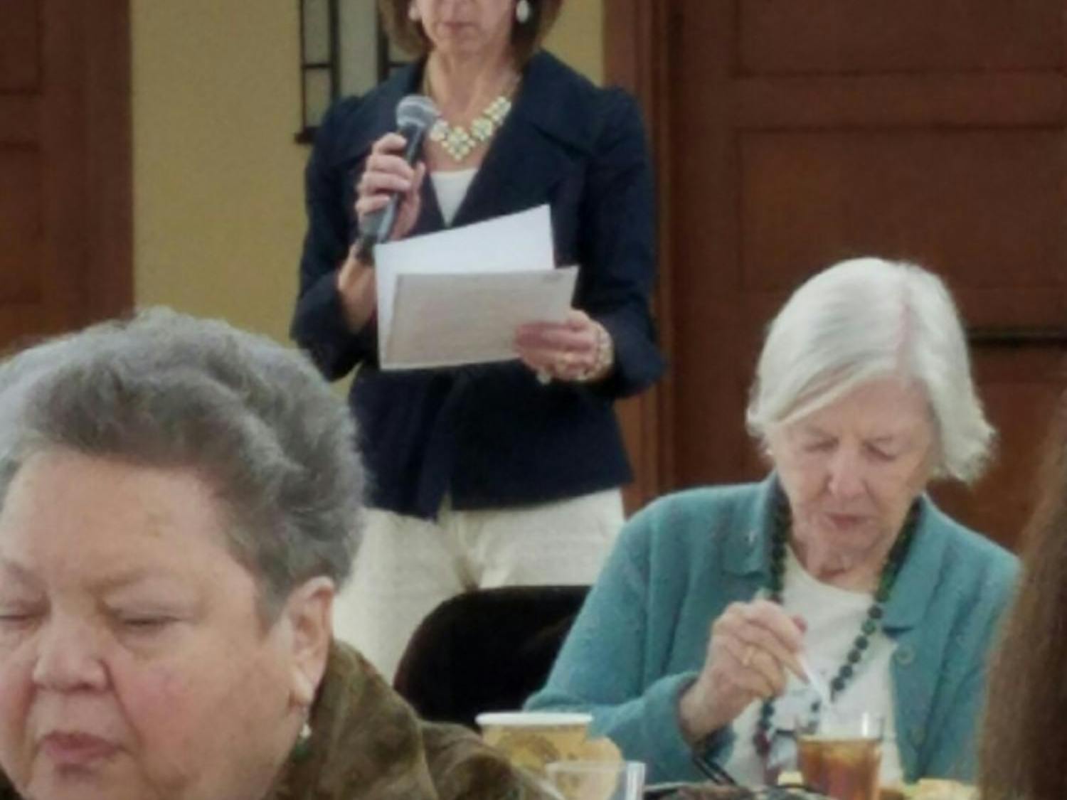 Stacey Yusko, the executive director of the Chapel Hill-Carrboro Meals on Wheels, speaks at a celebration event.