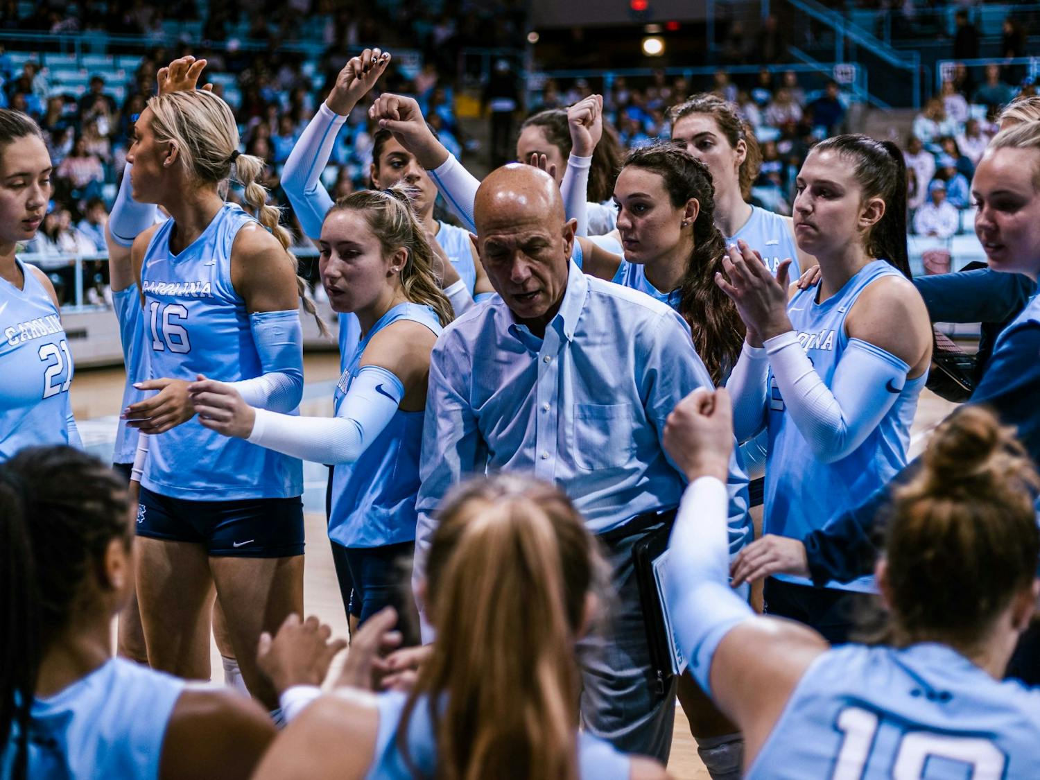 UNC head coach Joe Sagula and the team are pictured during a volleyball match against Louisville on Sunday, Nov. 13, 2022. Sagula announced his retirement in January after 33 years at the helm of UNC's program.
