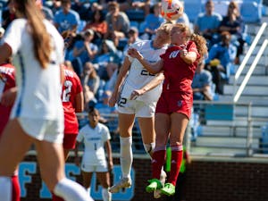UNC senior defender Tori Hansen (22) heads the ball during the UNC Women's Soccer 2-0 victory over NC State on Sunday, Oct. 9, 2022, at Dorrance Field.
