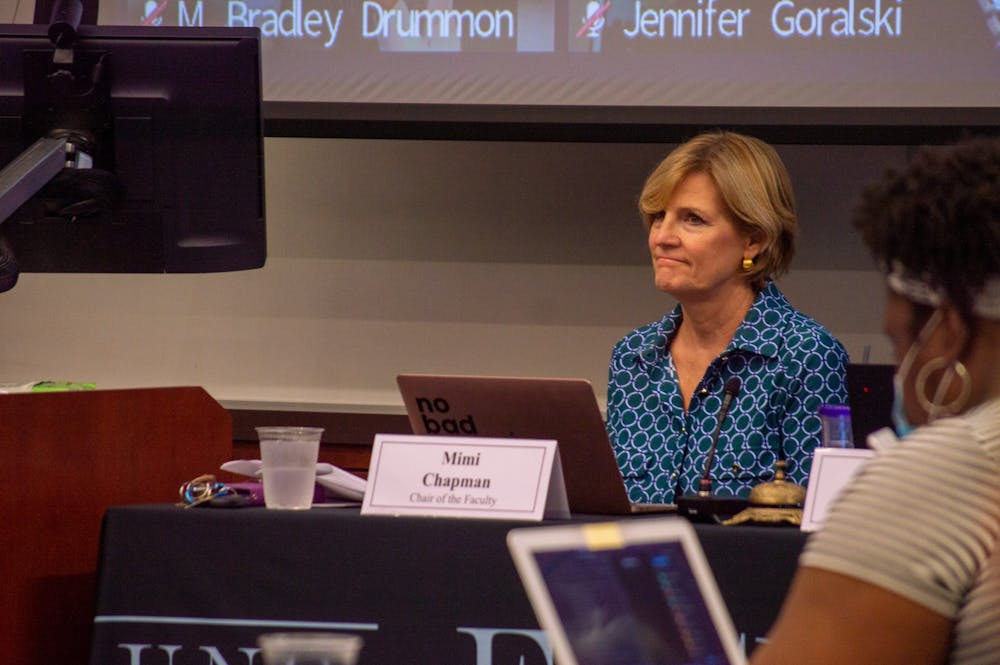 <p>Mimi Chapman, Chair of the Faculty Executive Committee, listens at a faculty council meeting in Karr Hall on Sept. 9, 2022.</p>