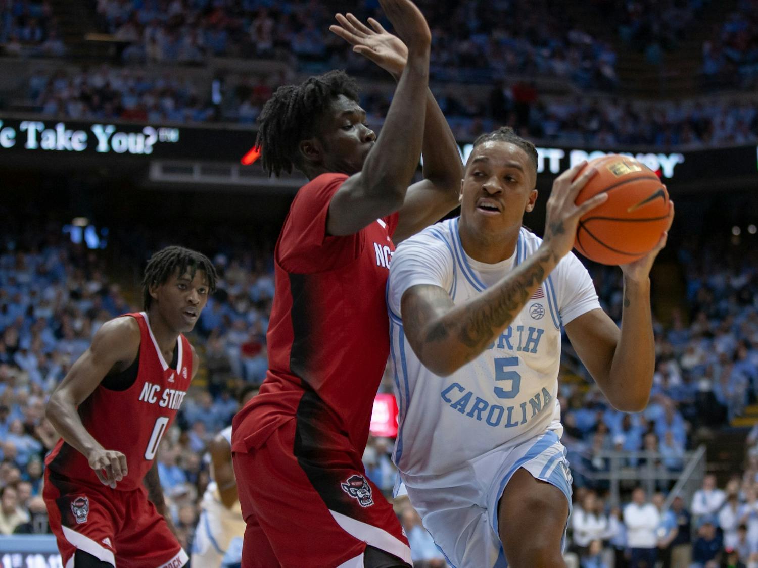 UNC senior forward/center Armando Bacot (5) passes the ball in the Dean Smith Center on Jan. 21, 2023, against the N.C. State Wolfpack. UNC won 80-69.