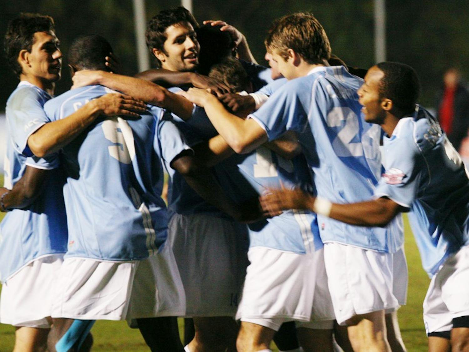 The North Carolina men’s soccer team celebrates one of their four goals against the N.C. State Wolfpack at WakeMed Soccer Park.  Wednesday’s win was the largest margin of victory in tournament history for UNC.